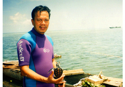 Researcher with marine turtle